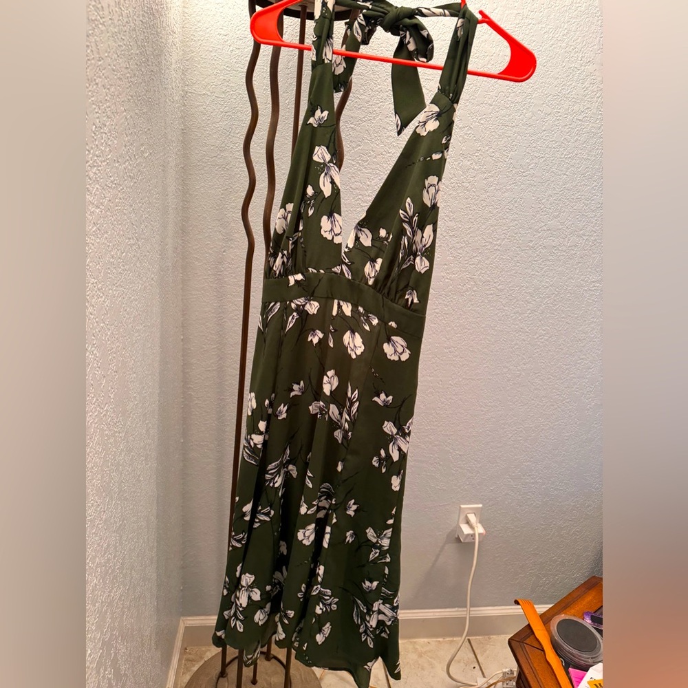 Brand new dress, never worn. Green with white flowers.